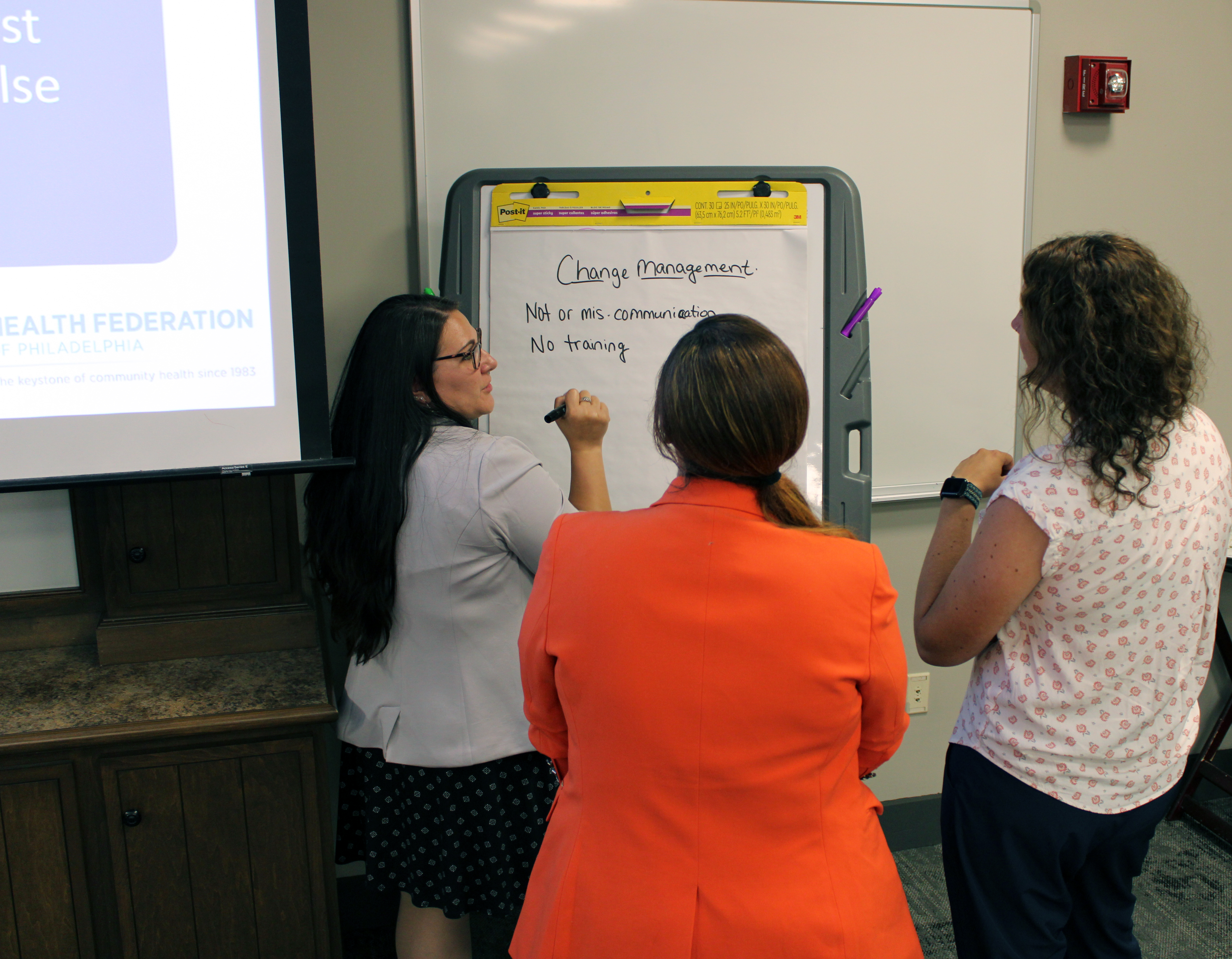 Participants work together at the 2024 HCCN in-person meeting